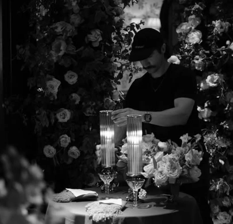A Blooming Haus florist working among floral installations